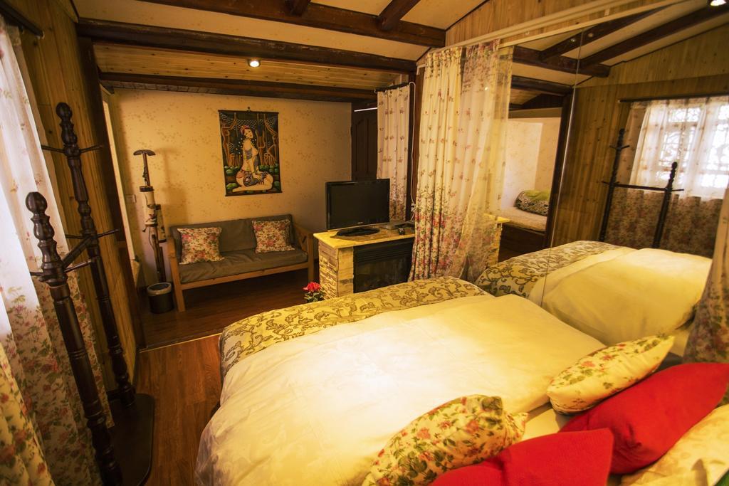 Secret Garden Hotell Lijiang  Rom bilde